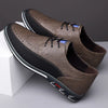 Herren-Lederschuhe mit Brogue-Verzierung und Gummisohle