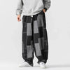 Herren-Patchwork-Jeans mit lockerer Passform und Kordelzug in der Taille